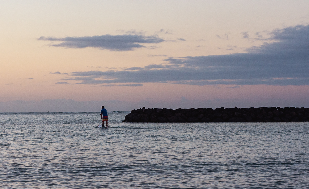 Lone paddleboarder his way out