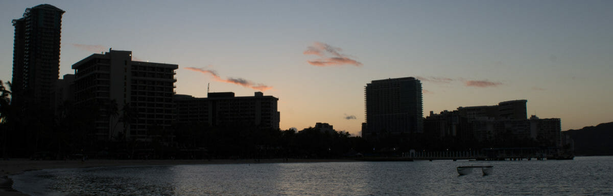 Sunrise looking back toward Waikīkī at Kahanamoku Beach