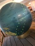 This globe shows major global shipping routes.