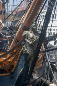 The figurehead on the prow of the HMS Surprise