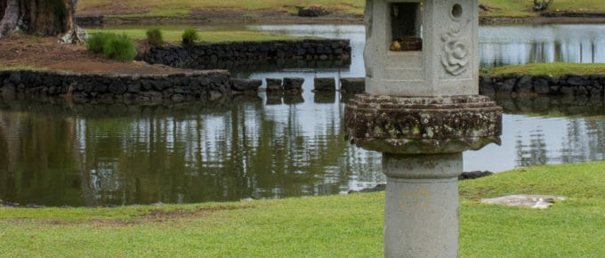 Liluokalani Gardens statuary with lagoon in background