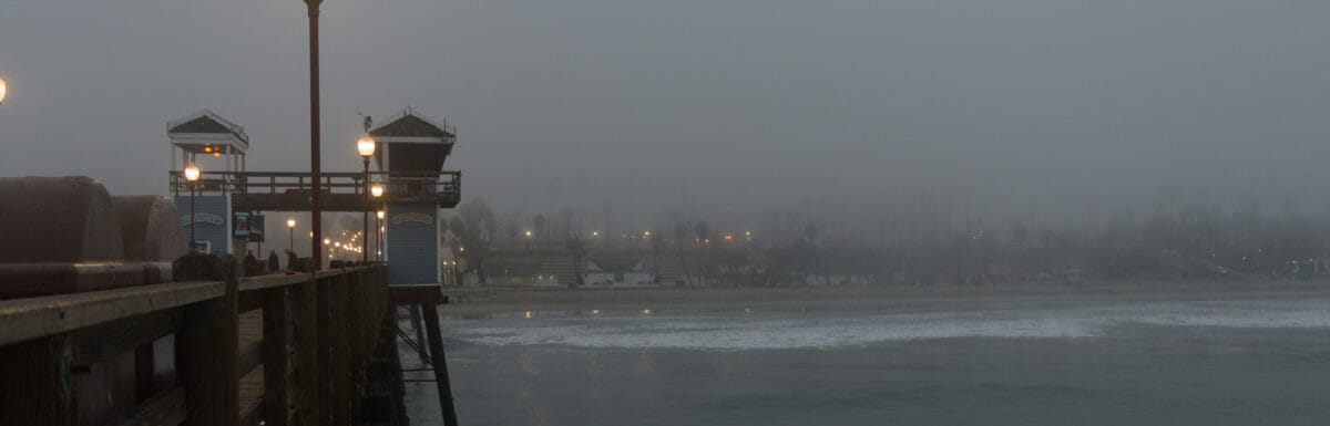Oceanside Pier looking back toward shore on a foggy morning