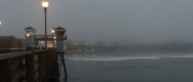 Oceanside Pier looking back toward shore on a foggy morning