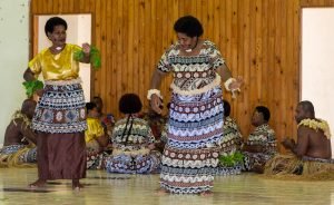 Singers in background while dancers perform