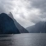 Milford Sound - a small boat cruises the sound