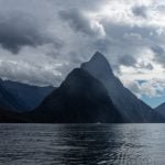 Milford Sound surrounded by towering peaks