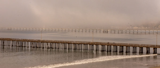 Three piers and  plenty of fog